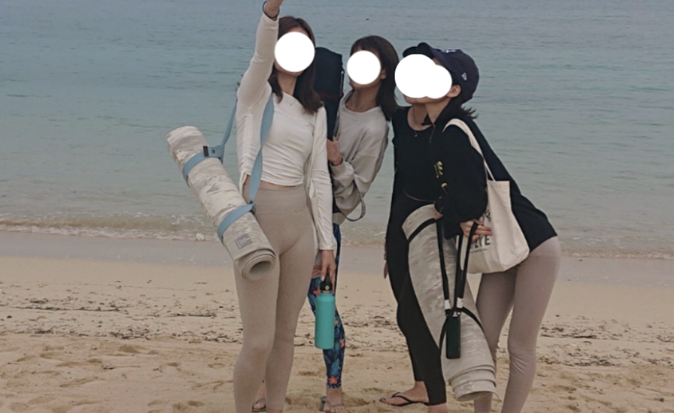 Group photo on the beach during yoga training