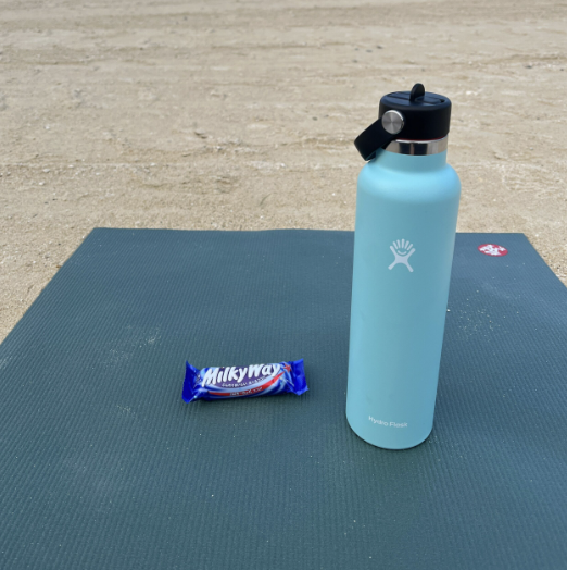 Yoga mat with a water bottle during training